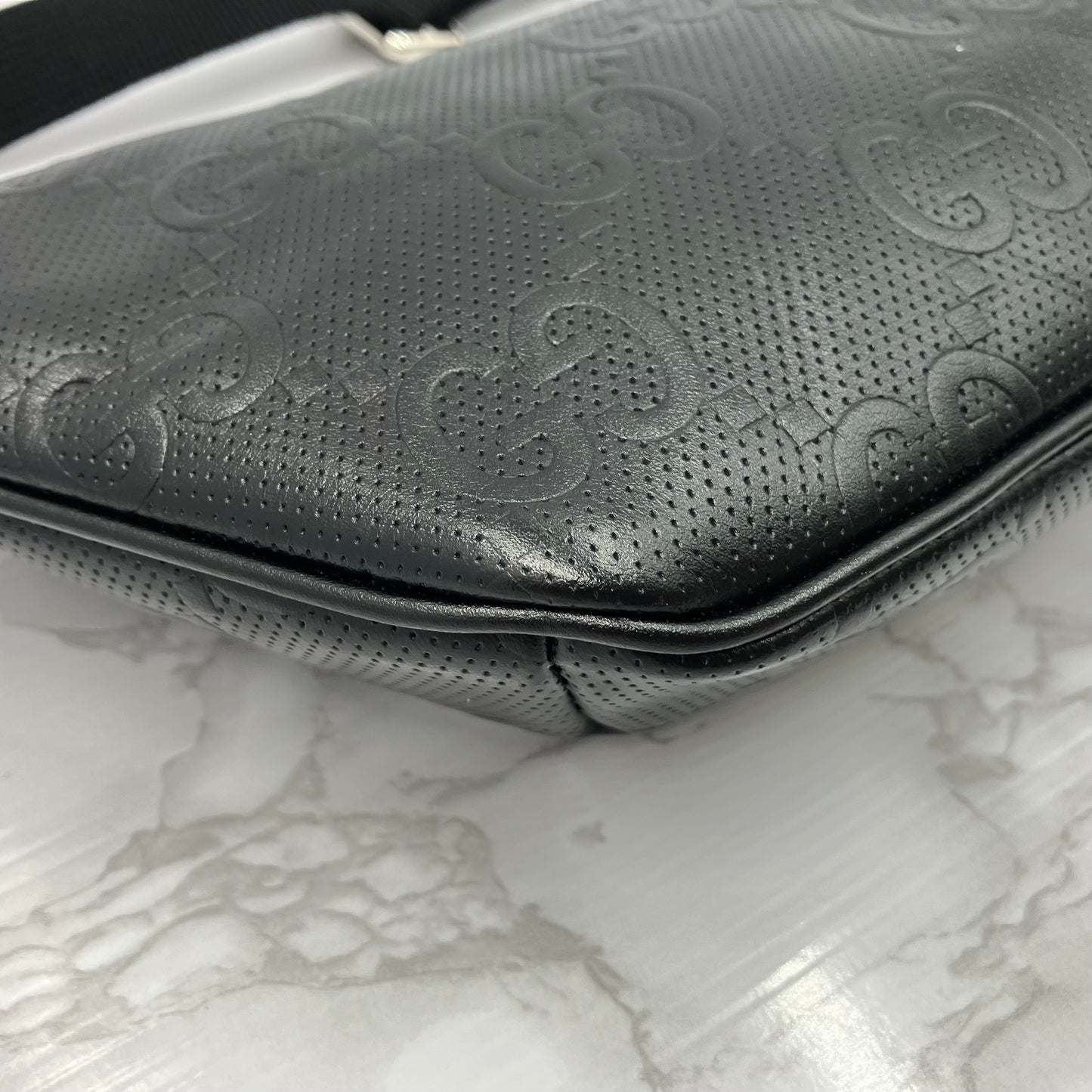 GUCCI GG Embossed body bag