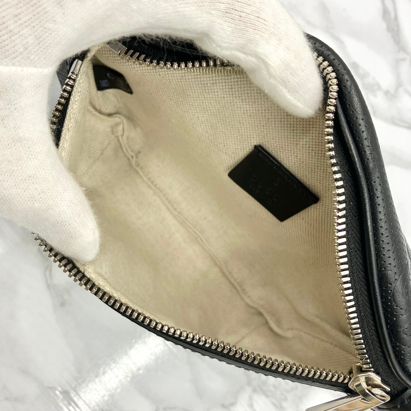 GUCCI GG Embossed body bag