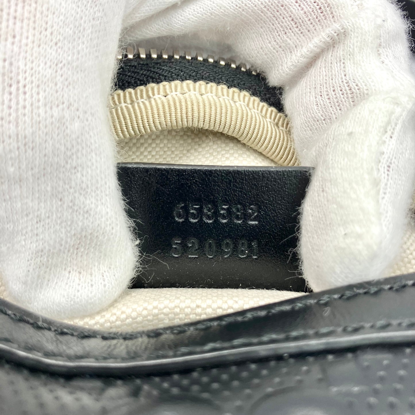 GUCCI GG Embossed body bag