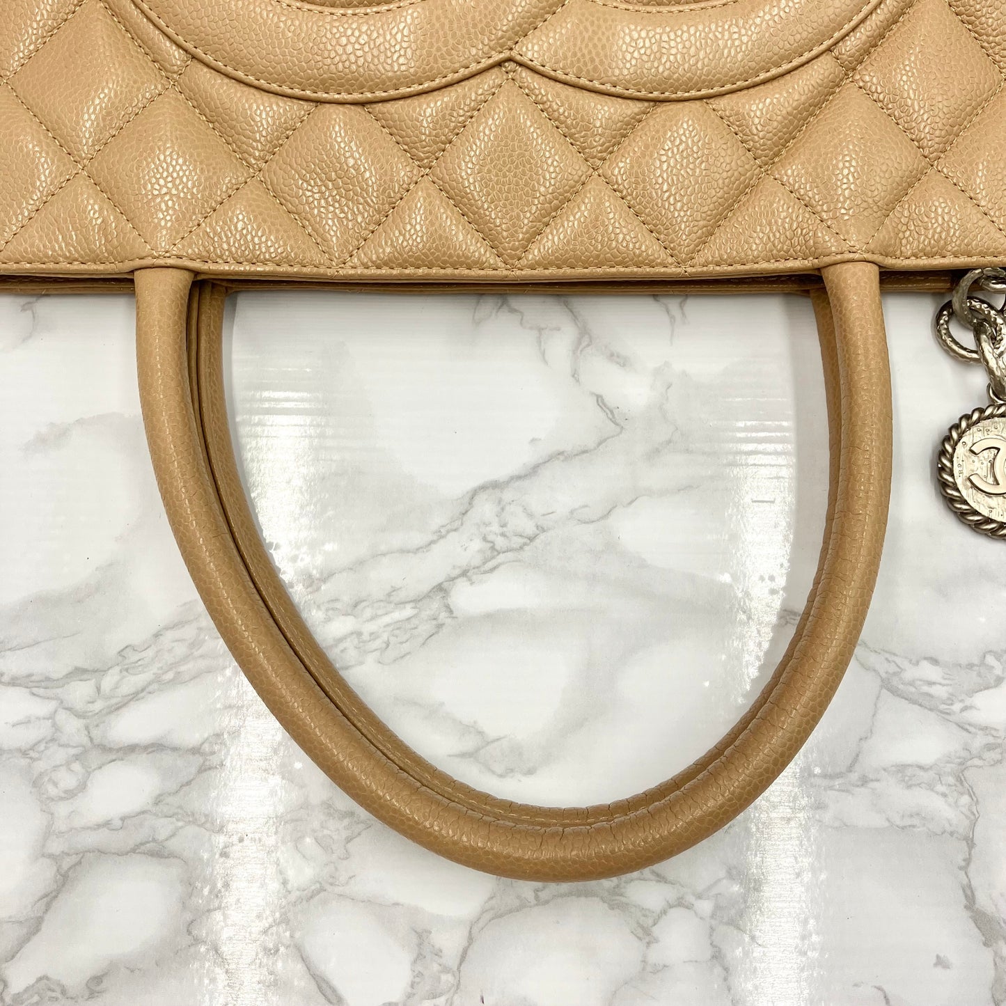 CHANEL Caviar skin medallion