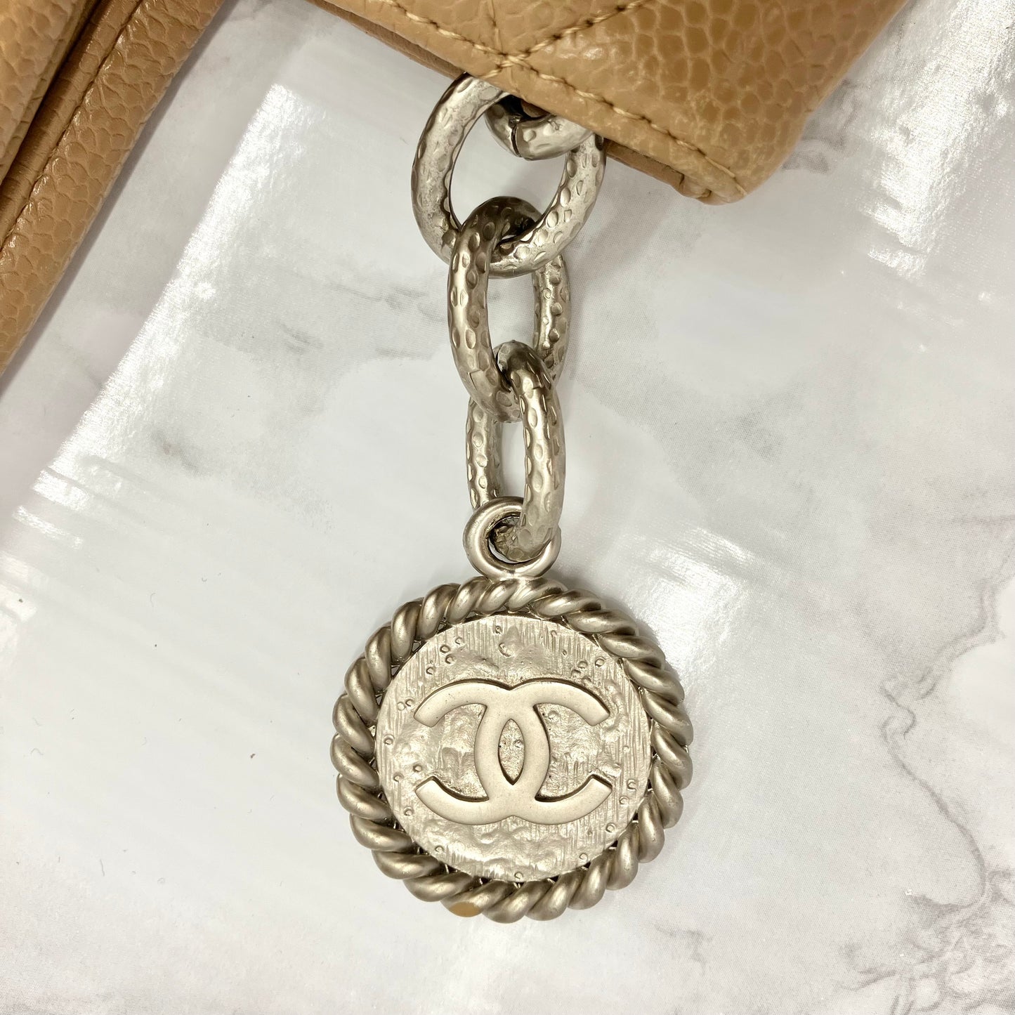 CHANEL Caviar skin medallion