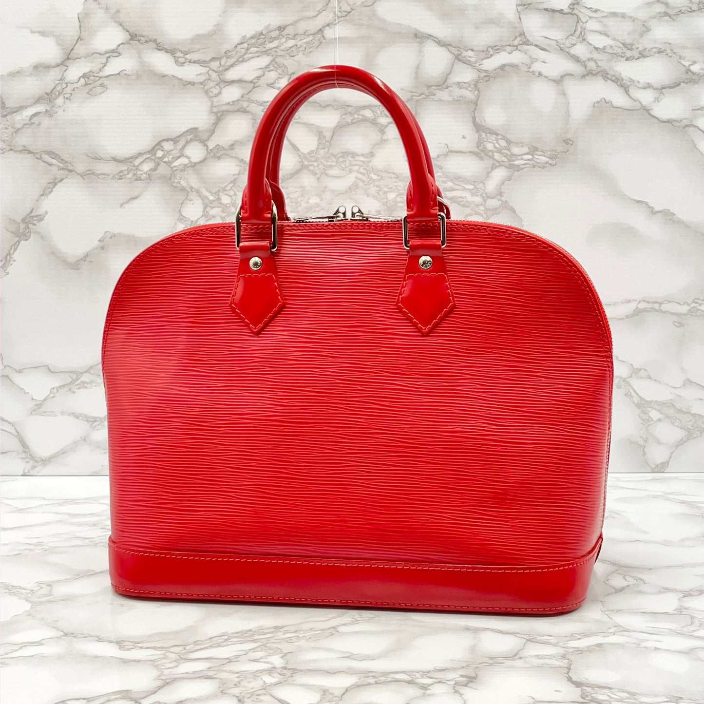 LOUIS VUITTON Epi Alma PM Handbag
