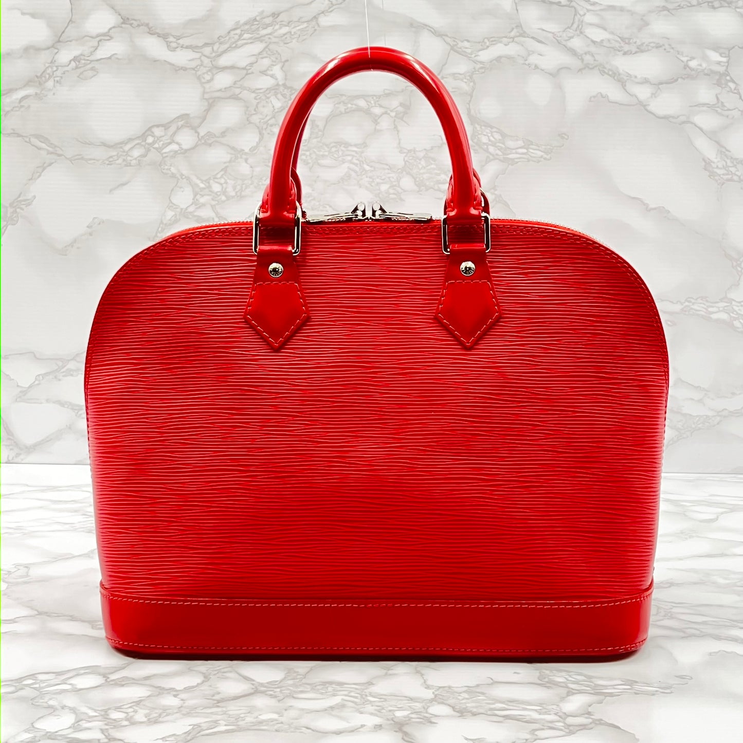 LOUIS VUITTON Epi Alma PM Handbag