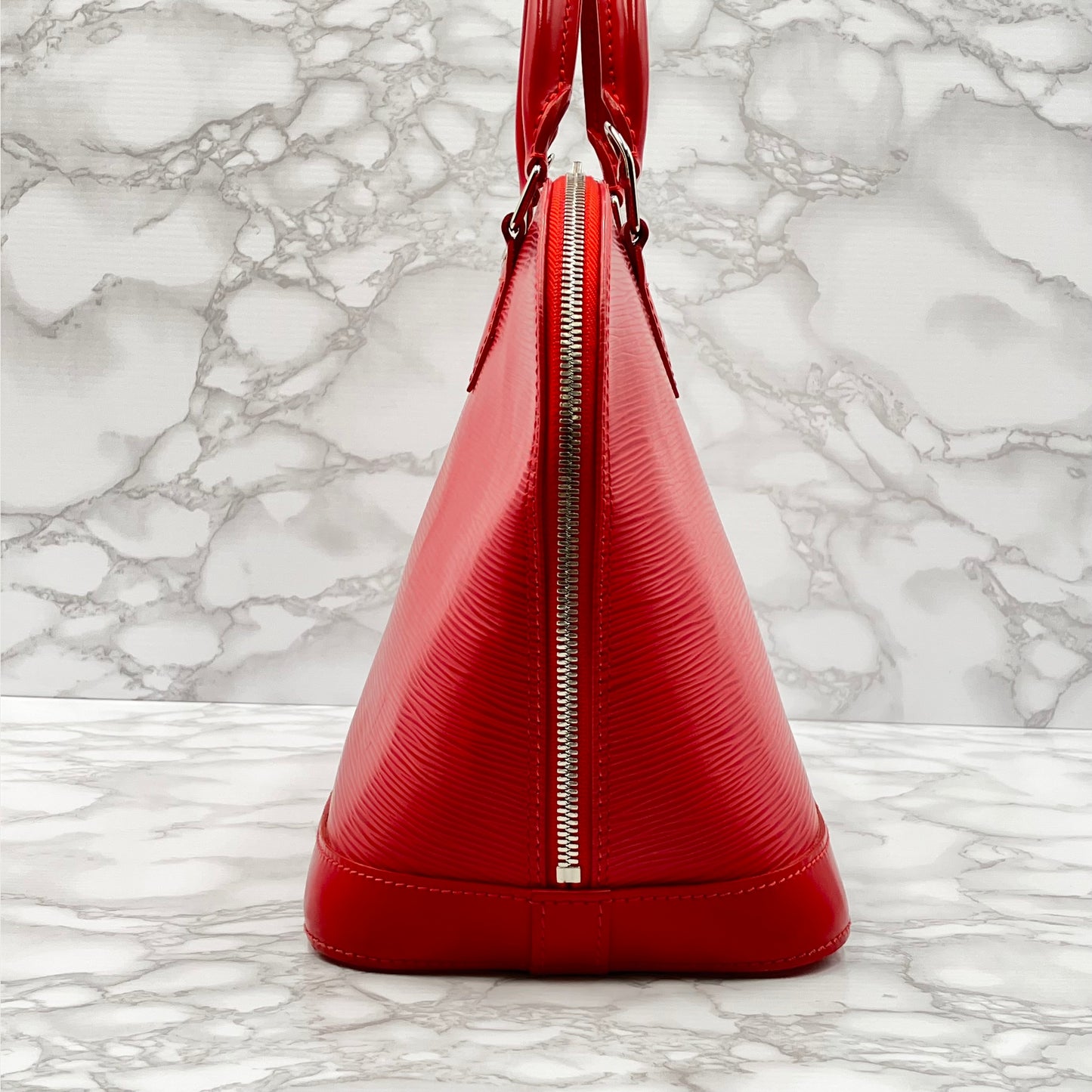 LOUIS VUITTON Epi Alma PM Handbag