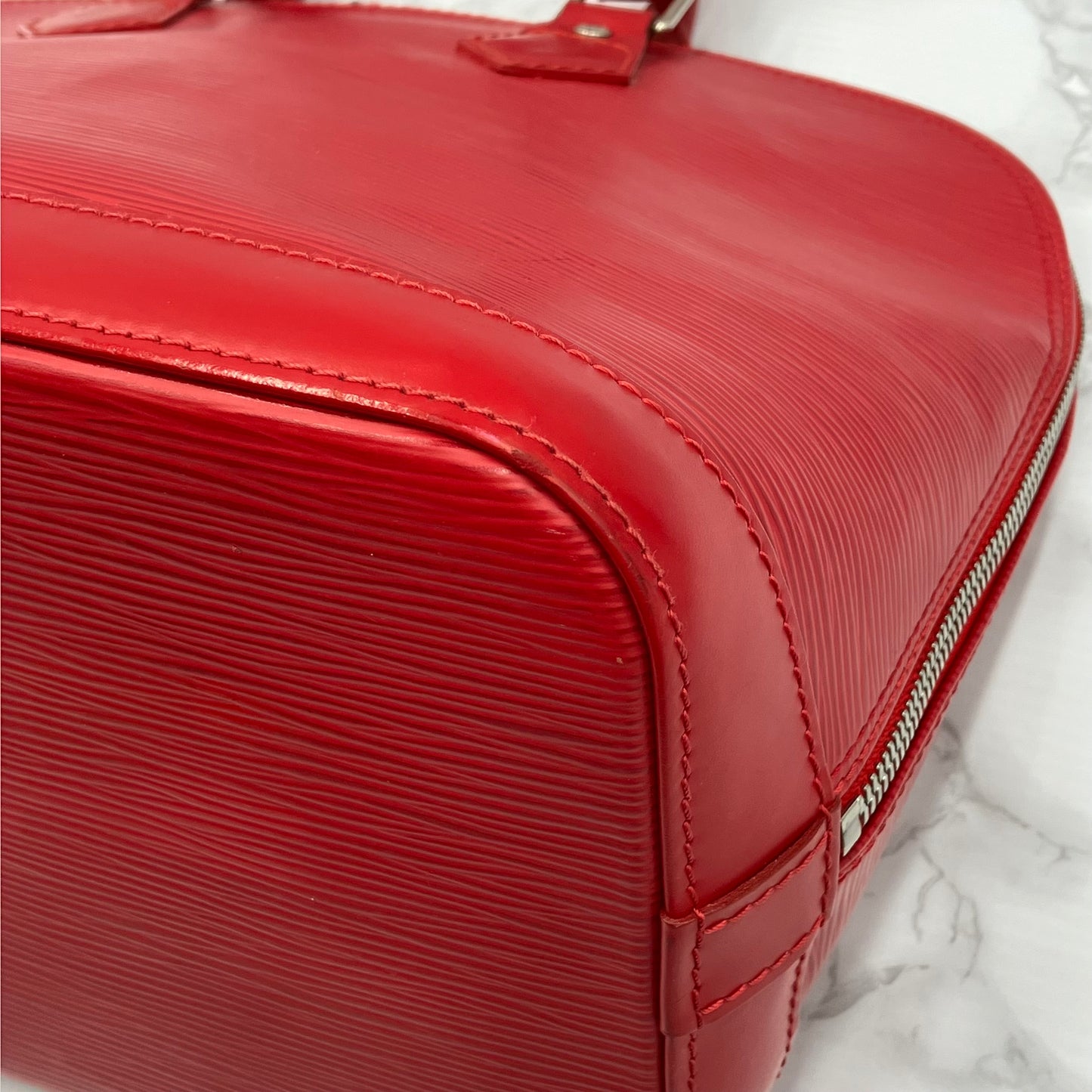 LOUIS VUITTON Epi Alma PM Handbag