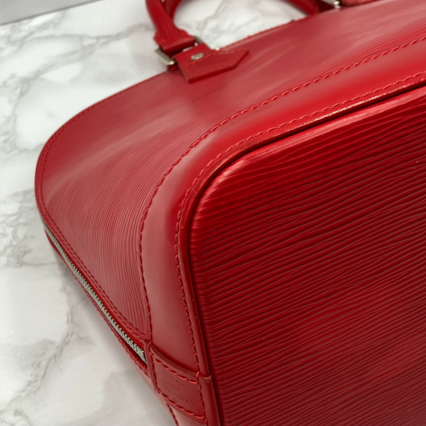 LOUIS VUITTON Epi Alma PM Handbag